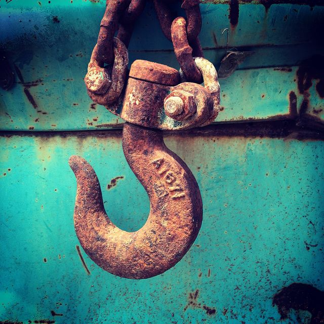 Rusty salvage yard hook towing