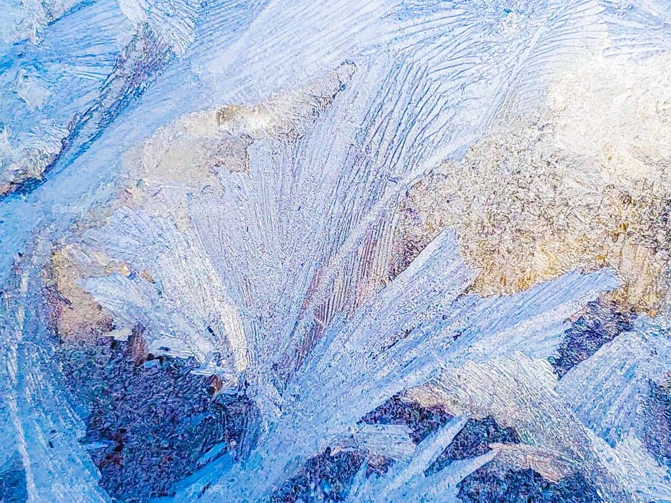 Abstract - textures of ice on an old window.