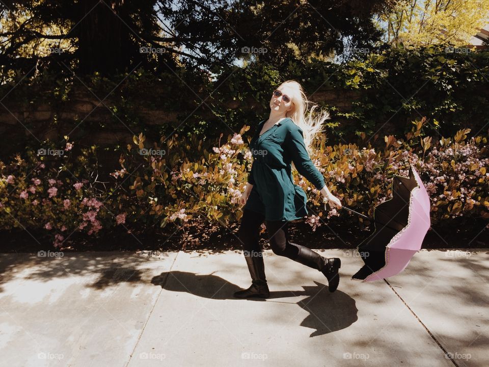 Blond with a pink umbrella