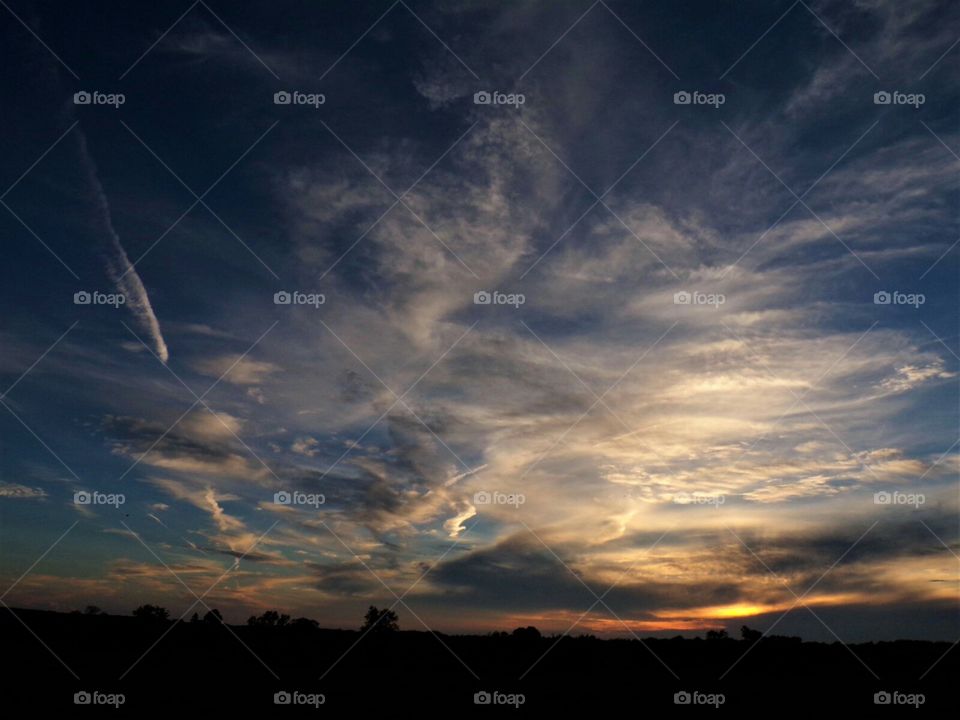 A mixture of blue sky and various cloud formation makes for a spectacular view.
