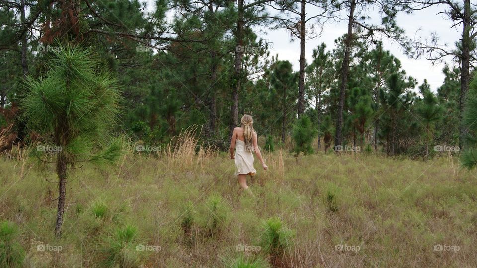 blonde girl dancing and spinning in nature