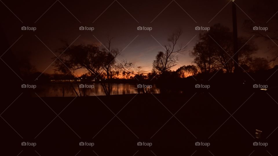 Sunset-Twilight-Night. Ending Twilight with Wild Reflections of Shore Landscapes on Lake Waters. Awesome Composure with BackLit Colors Just Plain Beautiful