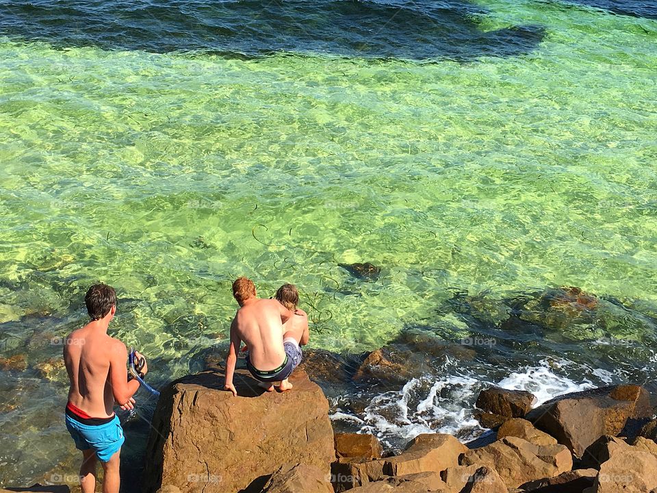 Teen boys at ocean, being boys