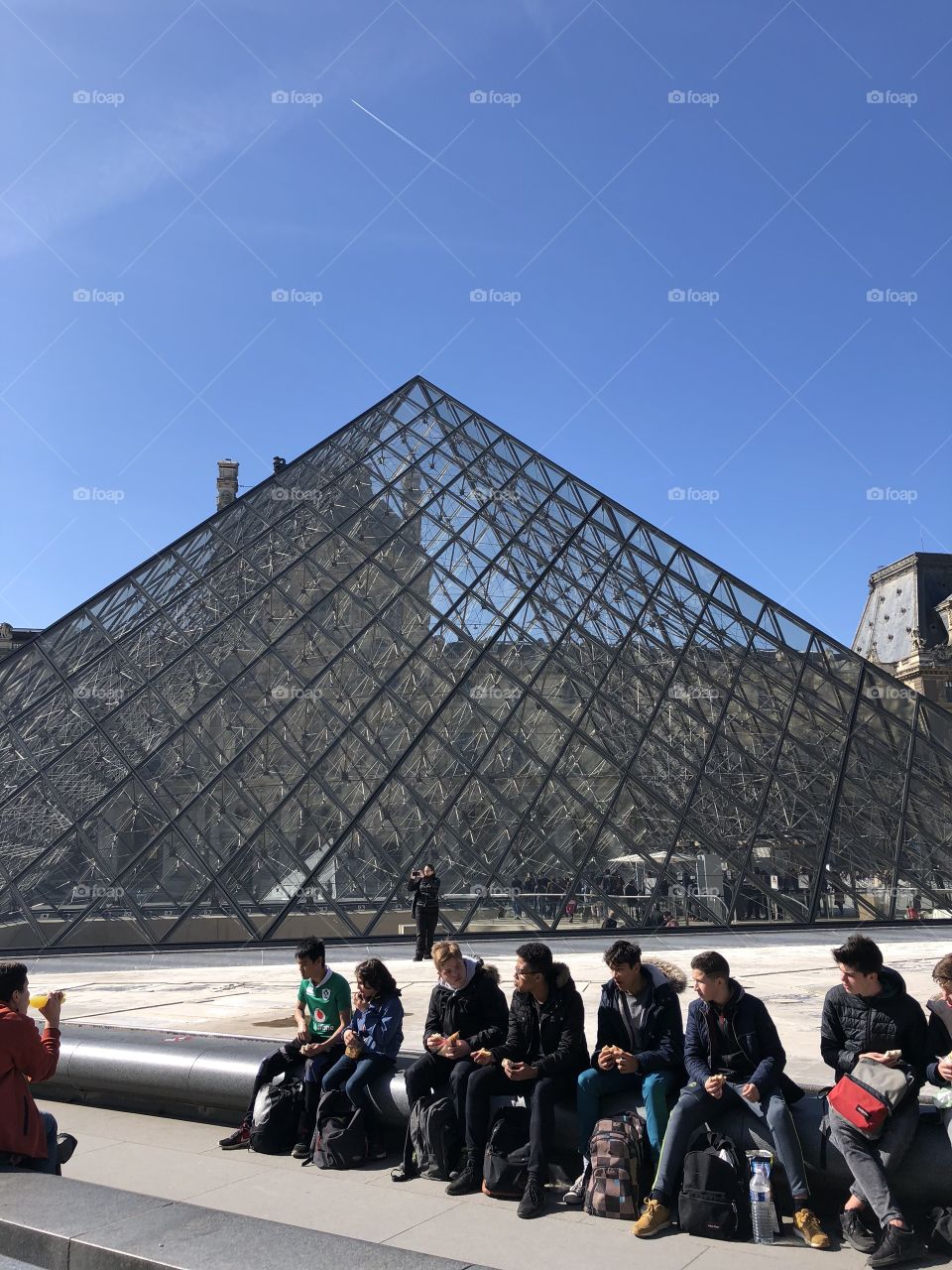 A gorgeous shot of the Louvre museum on a cloudless April morning in Paris, France. 