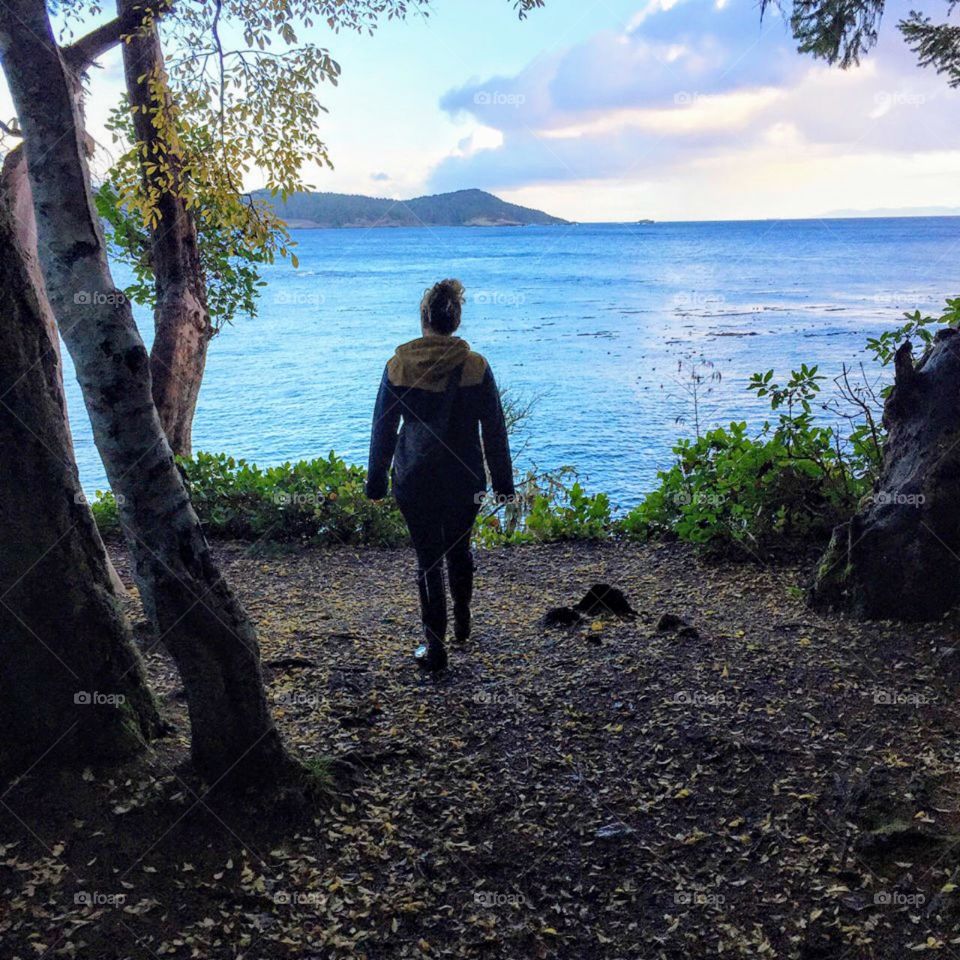 Hiking and overlooking the water at East Sooke Park on Vancouver Island, British Columbia. 