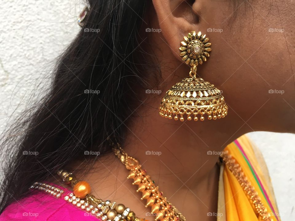 Close-up of woman's ear wearing jewellery