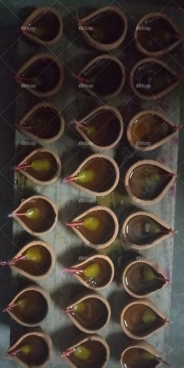 Diwali (also: Deepawali) is one of India's biggest festivals. The word 'Deepawali' means rows of lighted lamps. It is a festival of lights and Hindus celebrate it with joy. During this festival, people light up their houses with cup-shaped oil lamp.