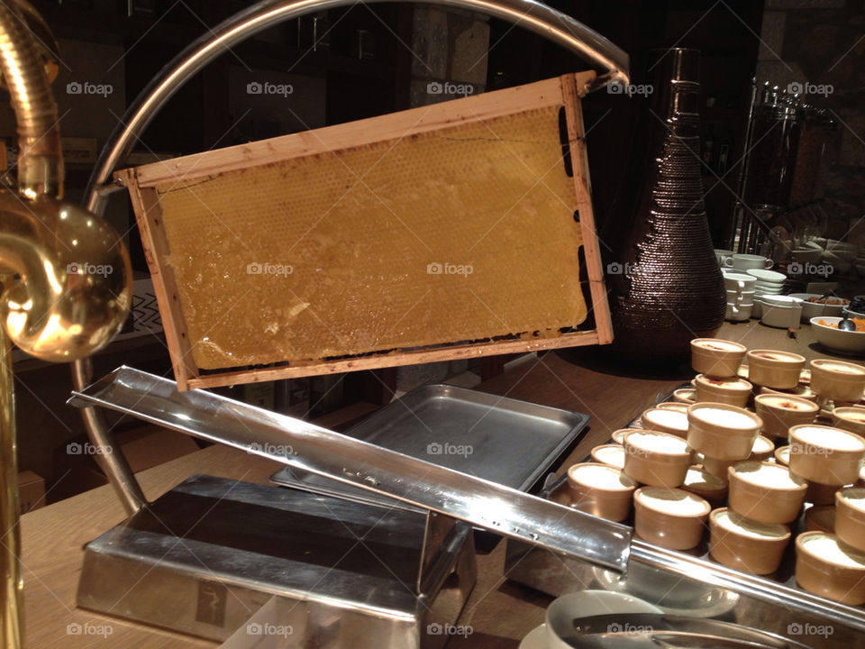 Honey dispensed directly from the honeycomb at breakfast