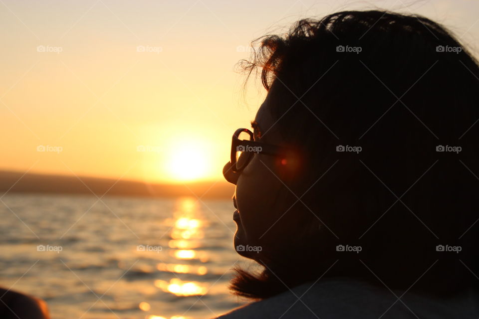 Girl wearing power eyeglasses, silhouette, girl silhouette closeup