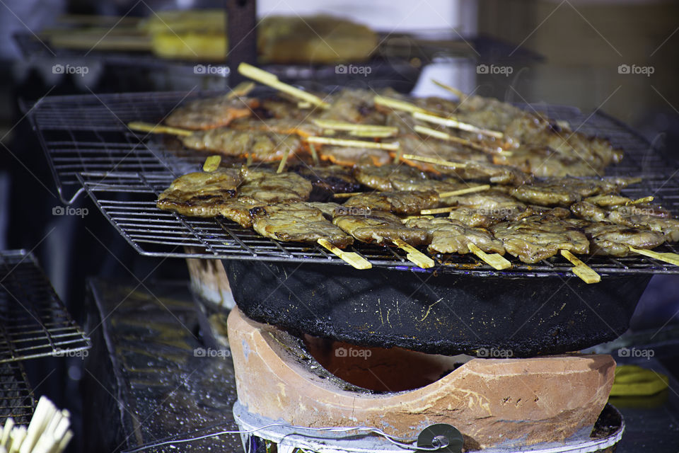 Grilled marinated pork with sauce Skewers and small on the steel grilles With the heat.