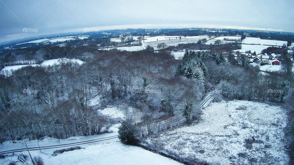 Drone image above a snowy, rural France.