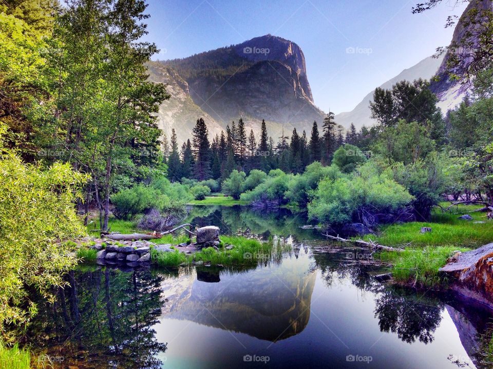 Mountains and trees reflecting in the lake