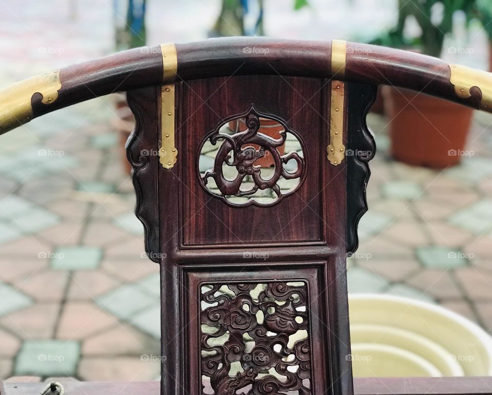 Beautiful ancient architecture on wooden chair 