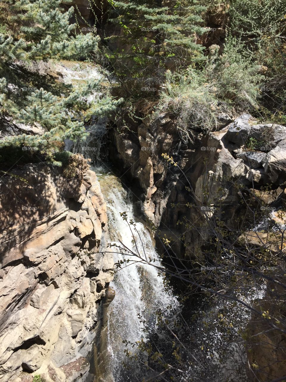 Waterfall between rocks. Closeup. Spring.
