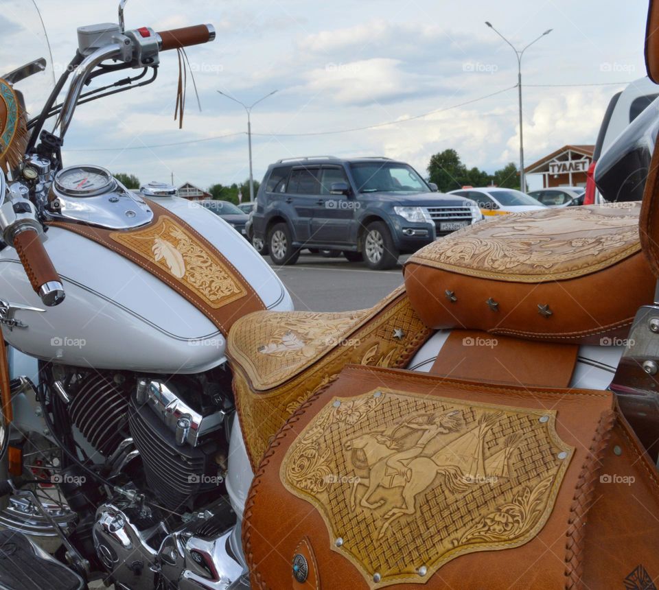 white bike  for traveling together with chrome details and light leather trim. Every road traveler's dream.