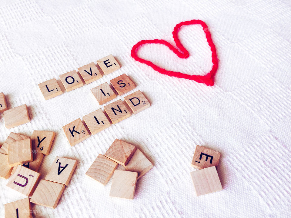 Love is kind in scrabble letters 