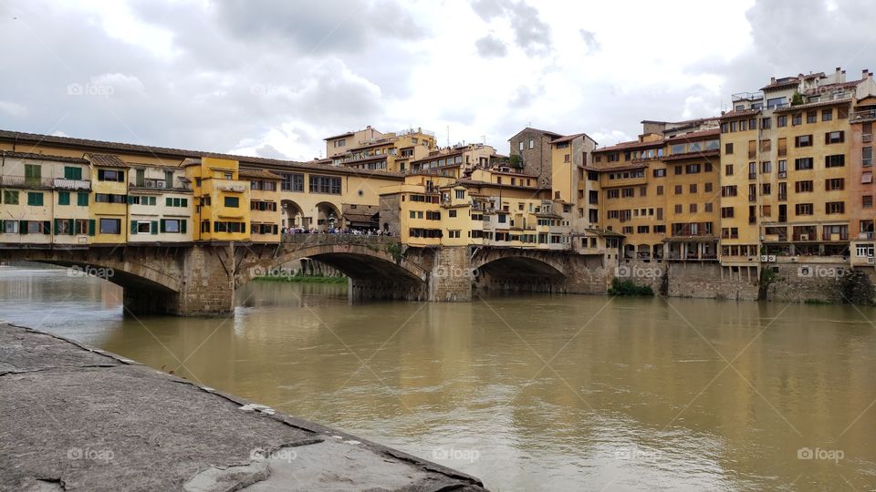 The famous Ponte Vecchio medieval stone bridge over Arno river in Florence, Italy, Europe