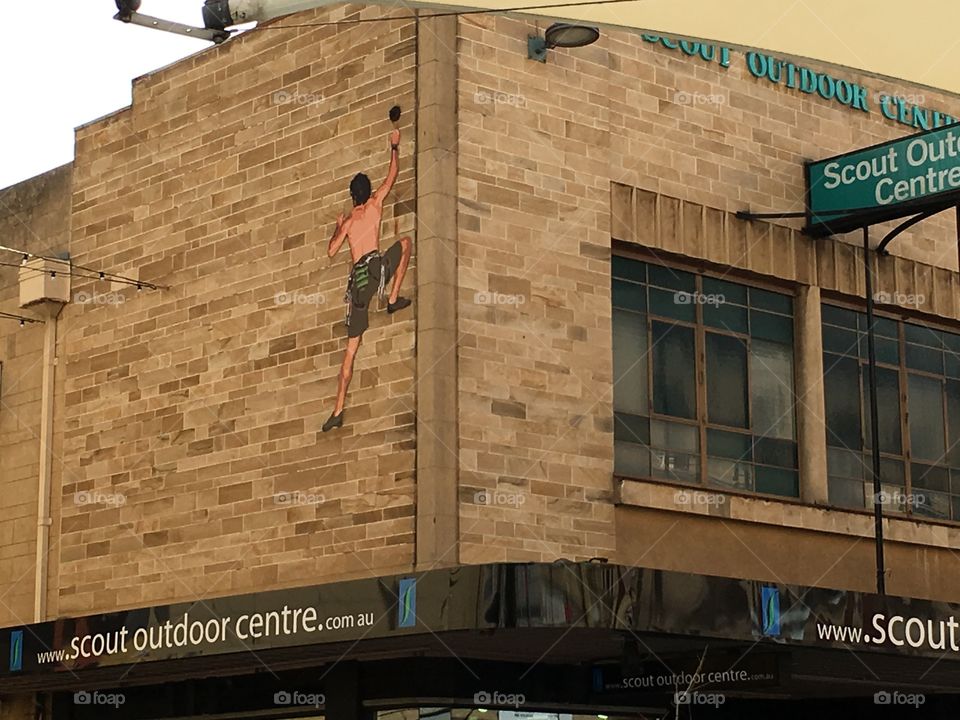 Adelaide south Australia building art of a rock climber climbing up side of building wall 