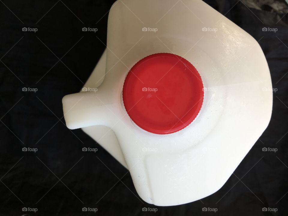 Milk container with red top