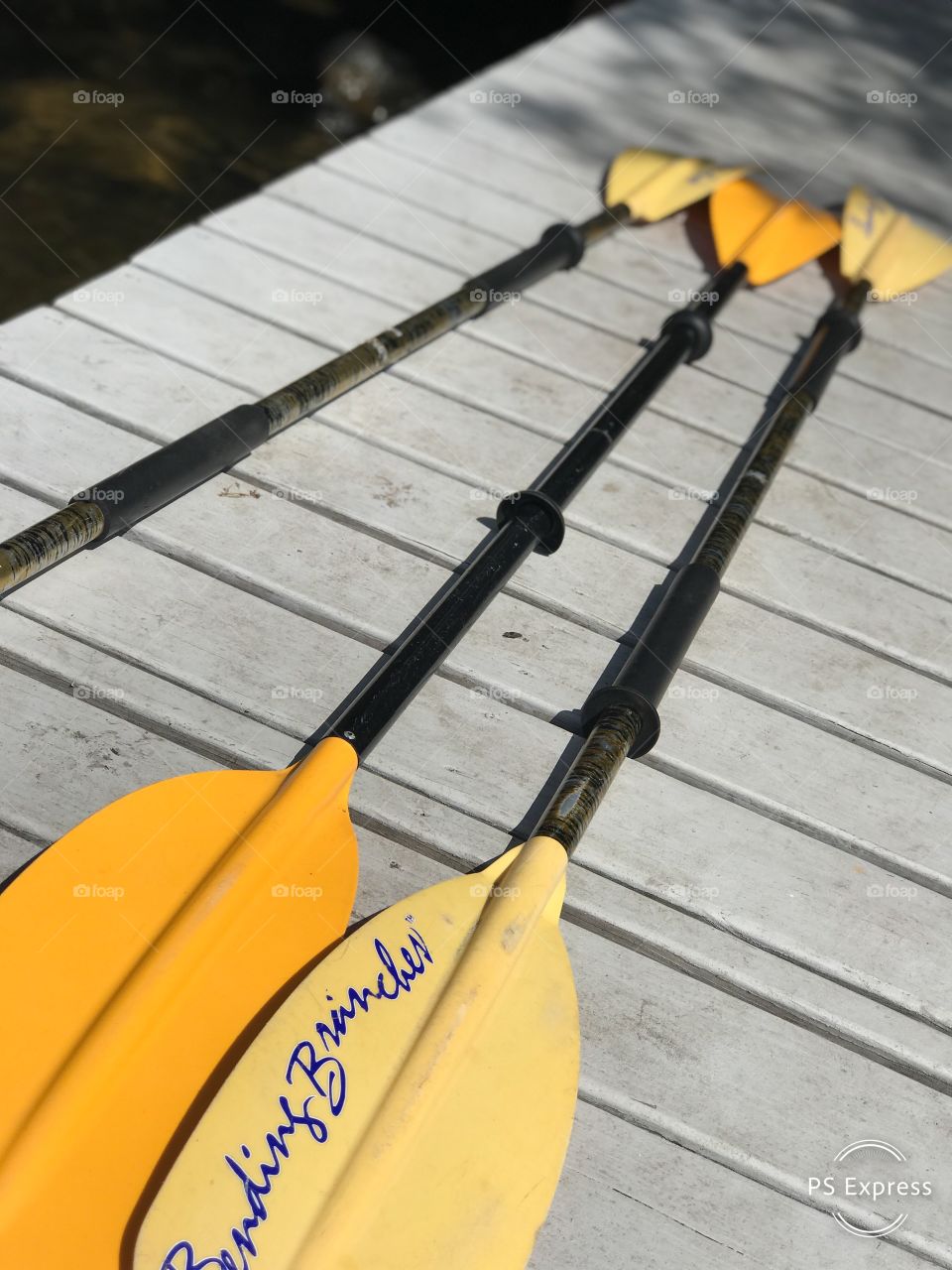 Kayak paddles dock side on lake ready for fun