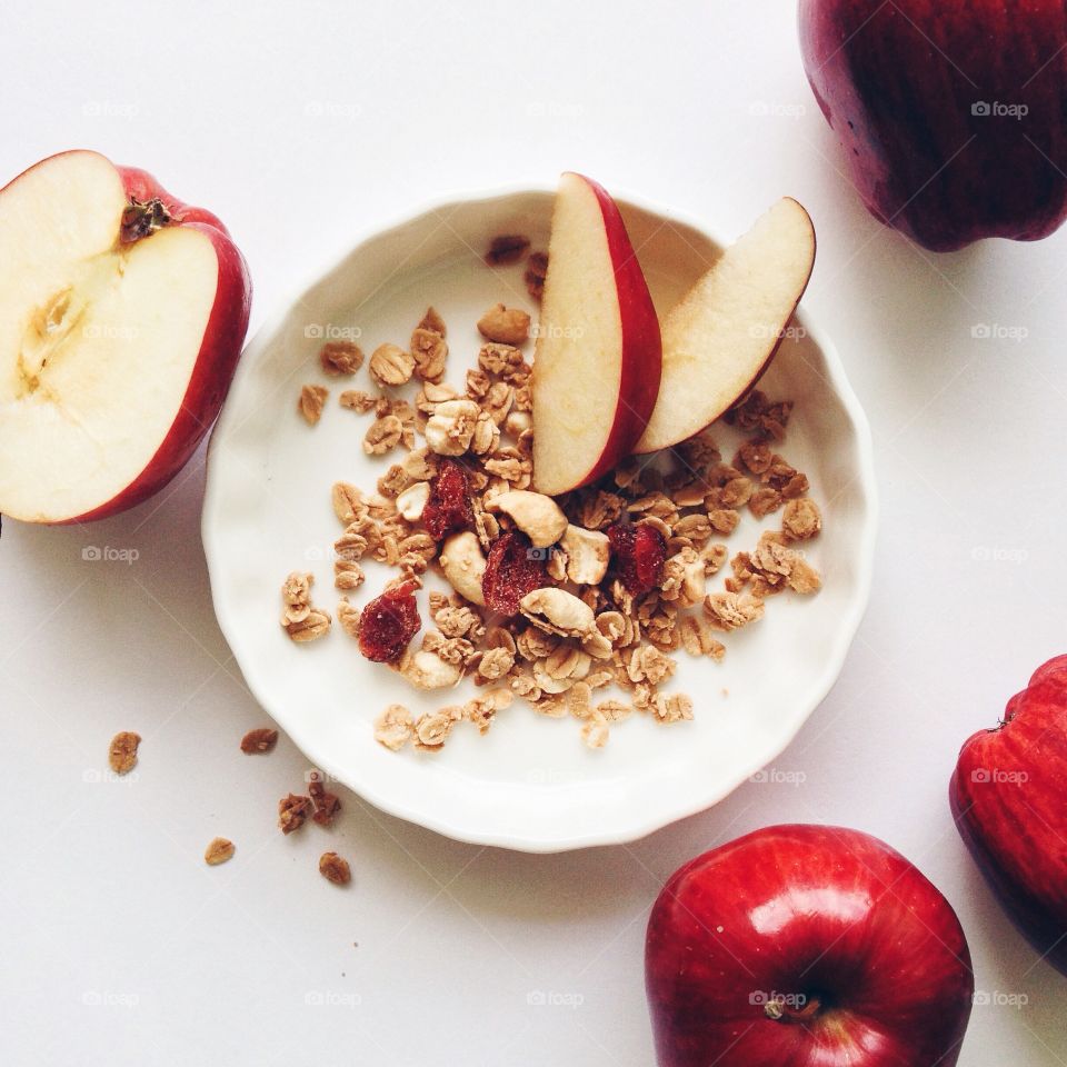 Breakfast with cranberry granola and apples.