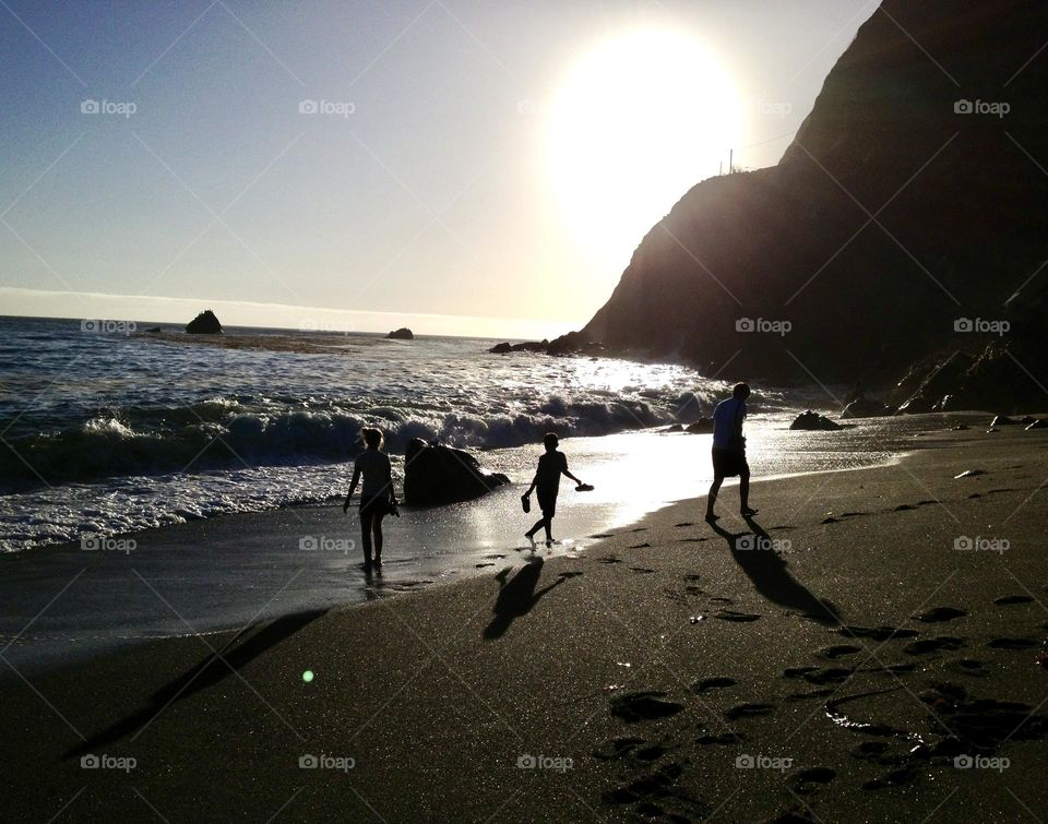 My three children playing on the beach is Big Sur, California.