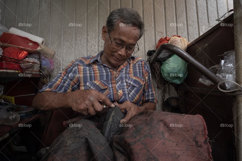 Shoemaker is working on the walking street