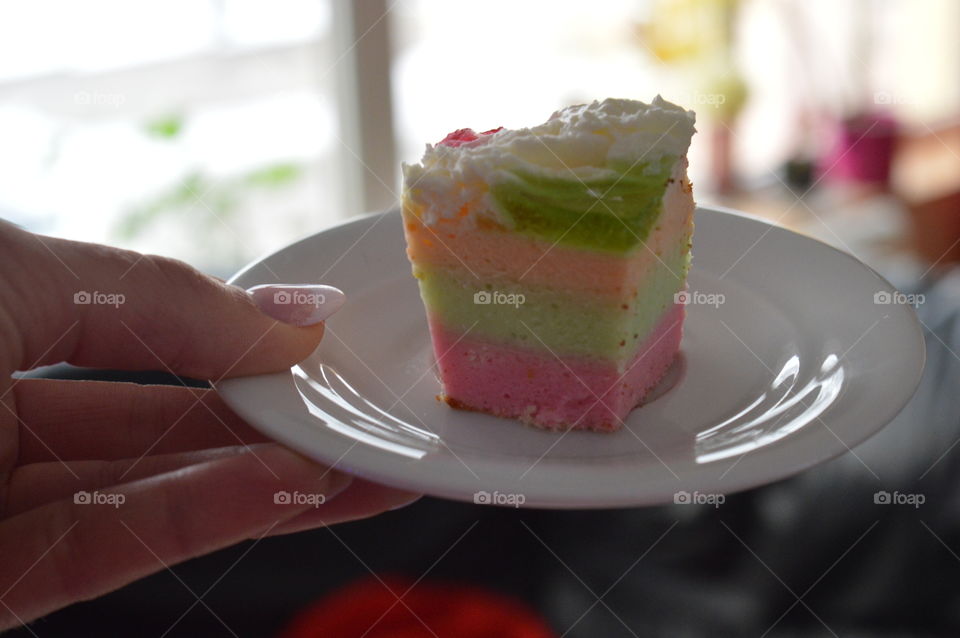 Women holding cake