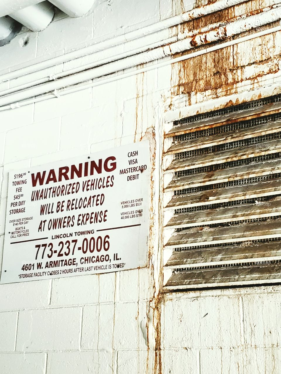 creepy warning sign in a parking garage