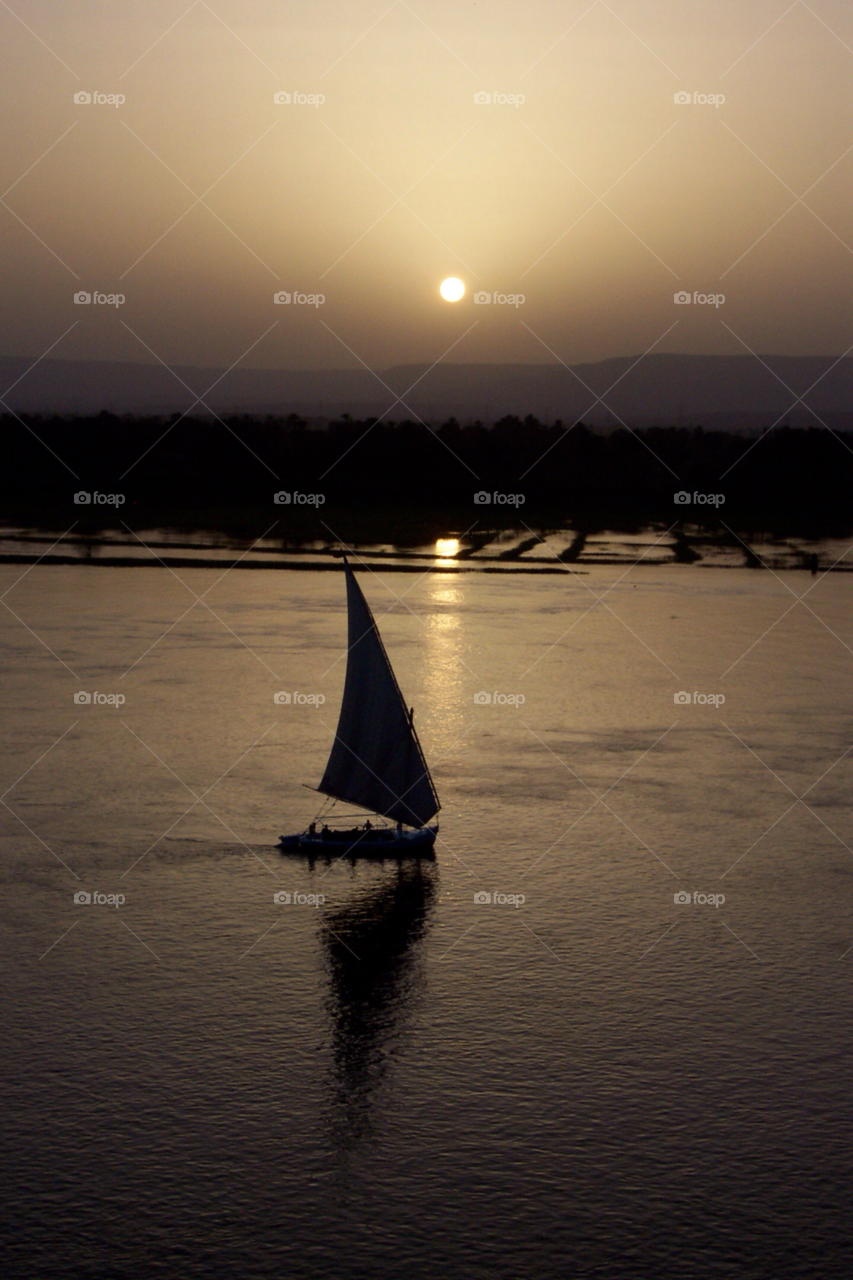 sunset sun boat reflection by moviemaniacuk