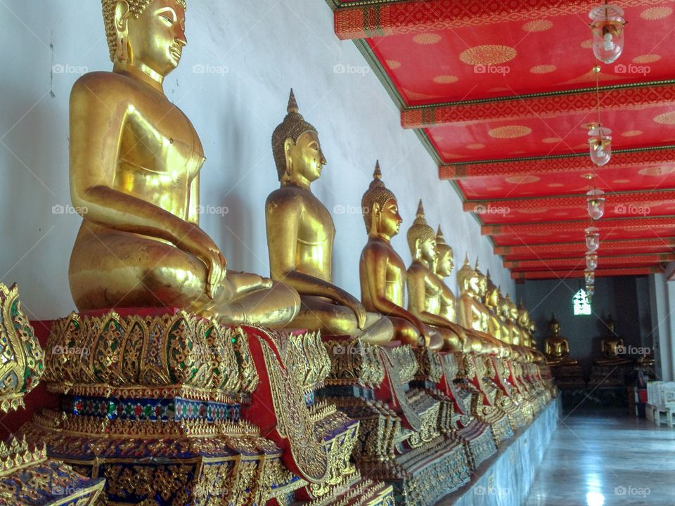 Hallway of serene Buddhas ...