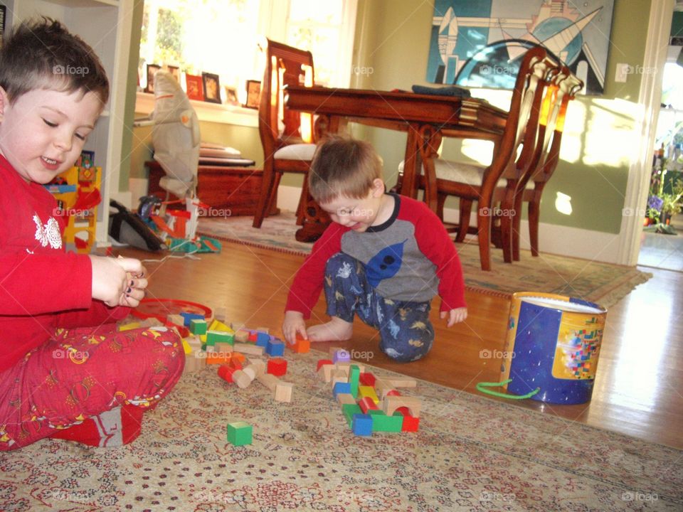 Young Boys Playing With Colorful Blocks