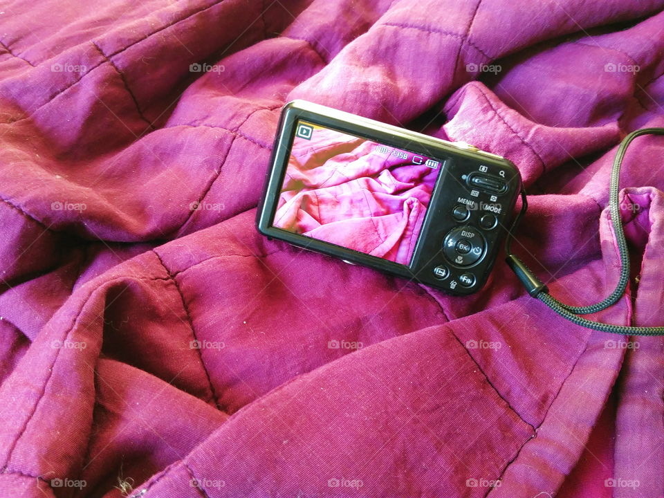 camera on a purple cloth