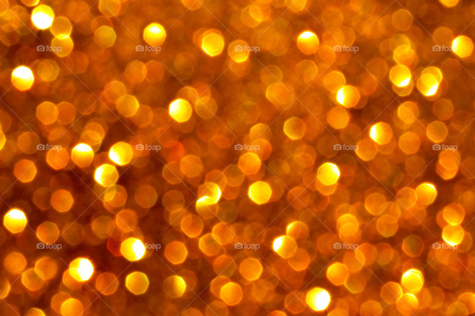 Golden yellow brown bokeh background.