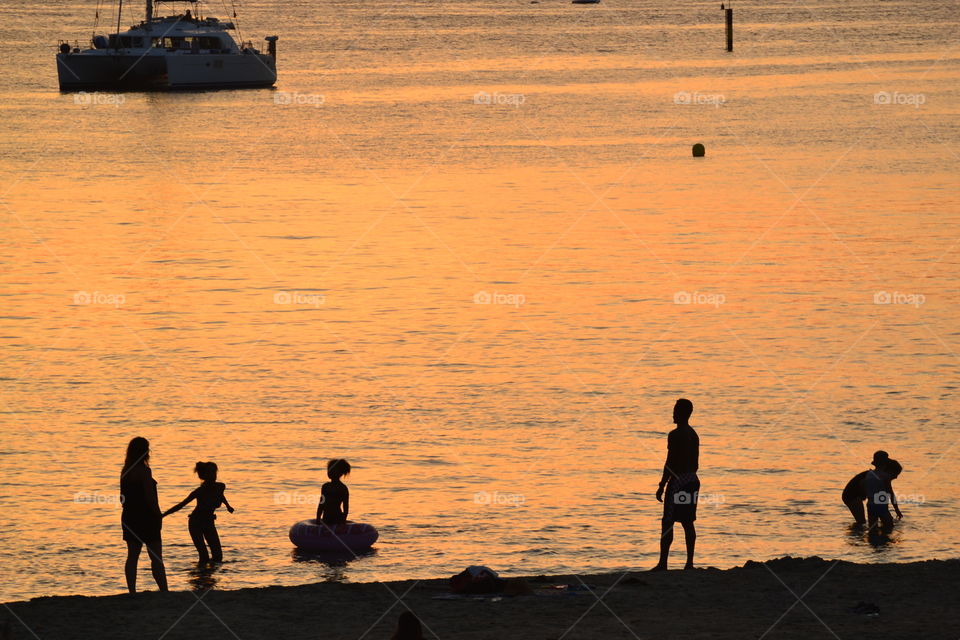 Children playing in the last moment of sunlight of the day