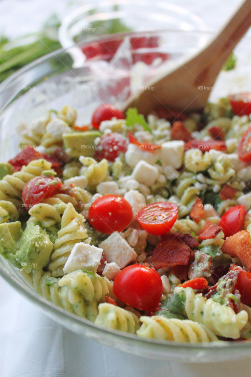 Pasta salad and tomatoes with cheese