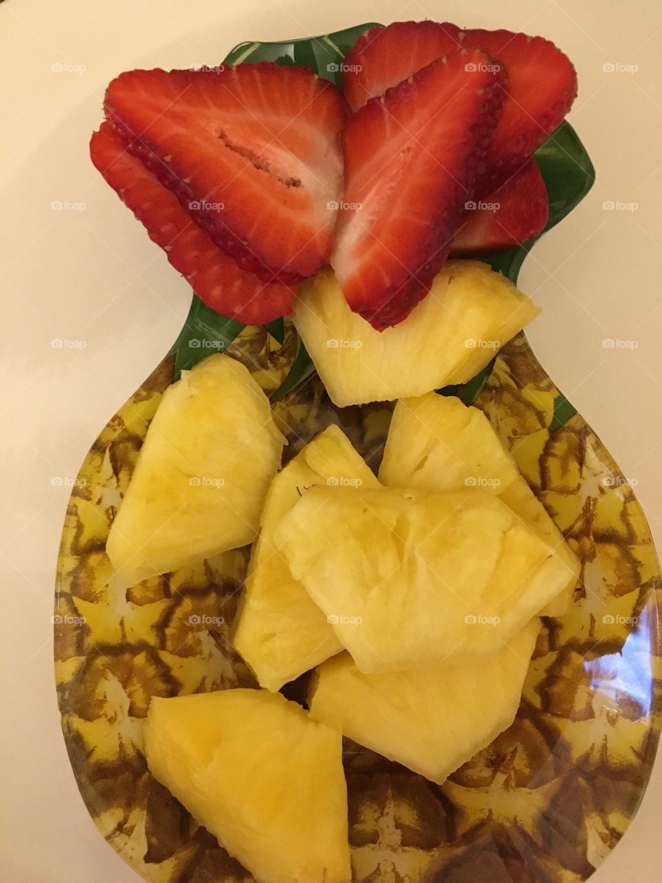 Pineapple & strawberry served in dish
