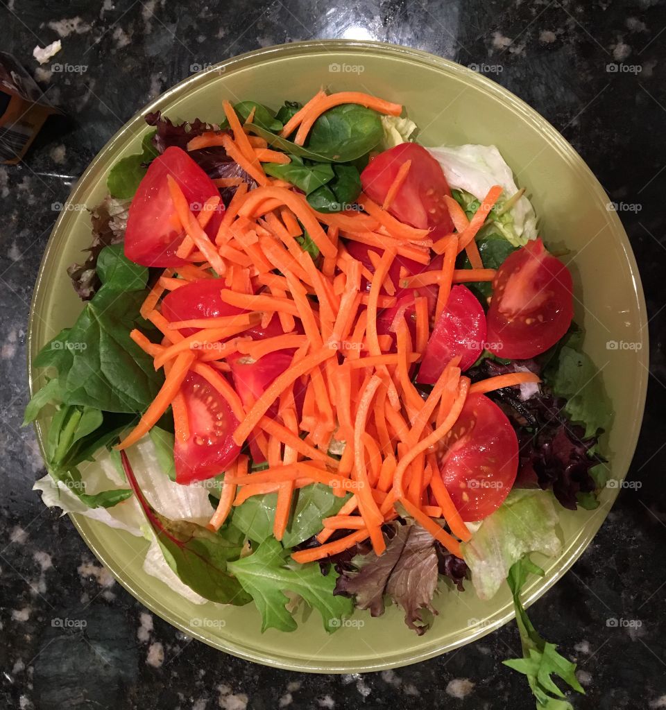 This salad is not only delicious tasting it’s food for the eyes as well with orange carrots contrasting with bright red fresh tomatoes on a bed of crisp greens. 