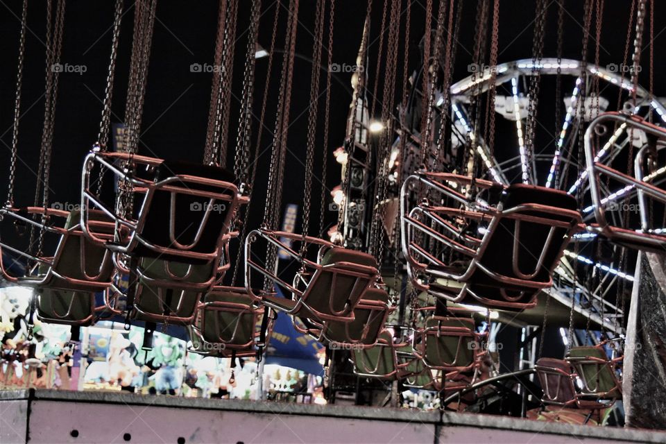 Empty amusement park ride chairs 