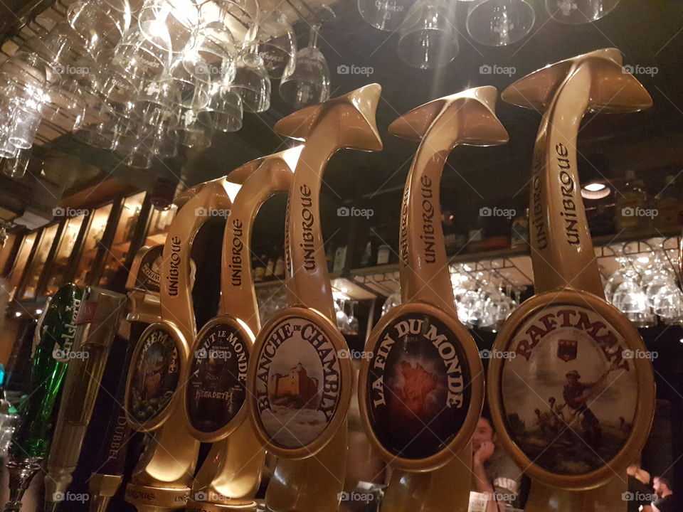 Several bier tap handles from a quebecker microbewery in a pub. Montréal. Québec. Canada.