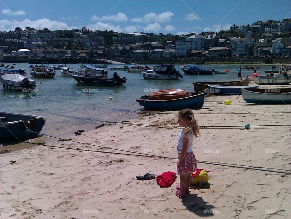 blonde, Caucasian little girl ,looking out, at the, boats in St. Ives , cornwall, South, West, of, England, United Kingdom, of, great Britain,
summer time, sunshine,