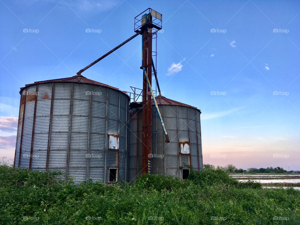 Silos of a farmhouse abandoned among the rice fields in the territory of Novara