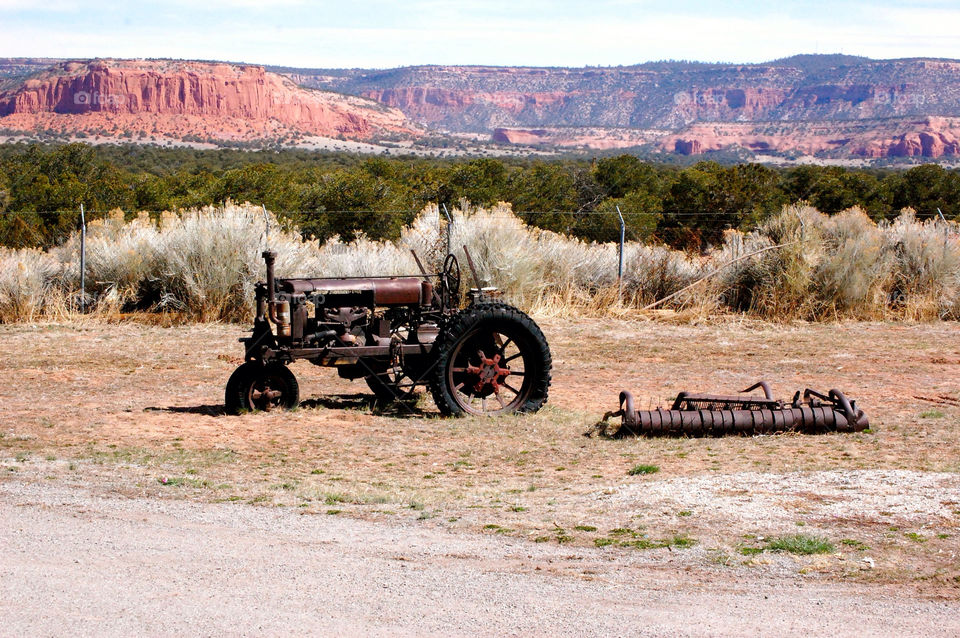 mountain desert farm tractor by refocusphoto