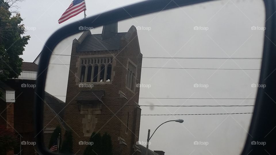 reflection of a church and city hall