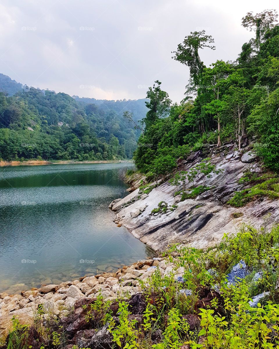 Scenic view of dam against mountain
