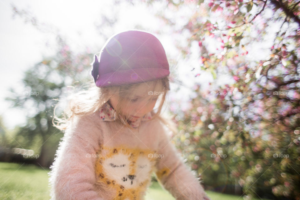 Cute Little girl in a blossom park