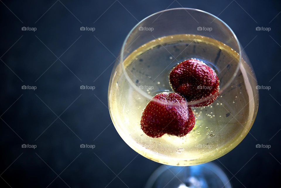 Wine glass with strawberries