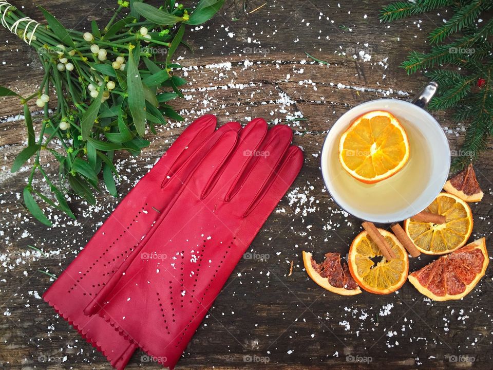 Tea and fruits slices on wooden table