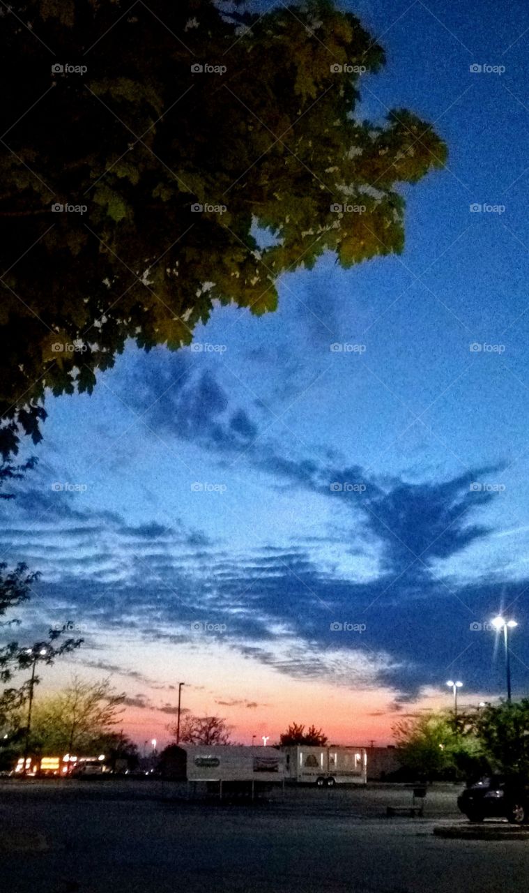 sunset over a parking lot