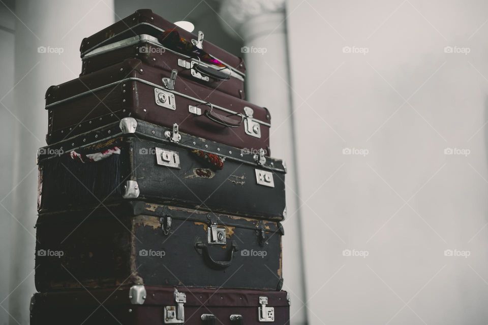 Stack Of Vintage Suitcases . background with large stack of antique suitcases.